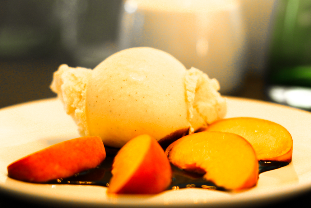 Vanilla bean ice cream with fresh peaches